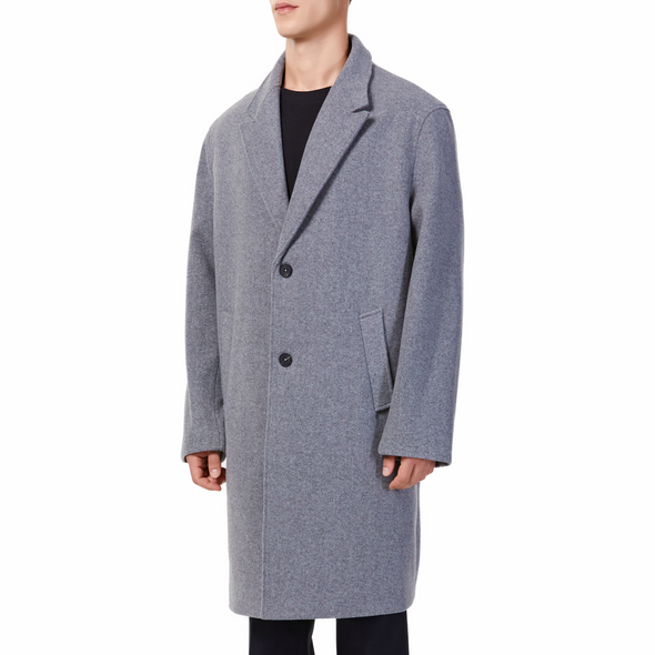 Men's long sleeve grey wool blend overcoat with 2 buttons at the front closer, large welt waist pockets and slightly oversized on a model - quarter view