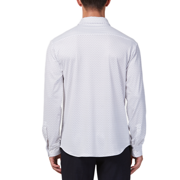 Men's white button up shirt with a dark blue dotted pattern all over, has long sleeves, button up front and pointed collar. made from knit fabric on a model - back view
