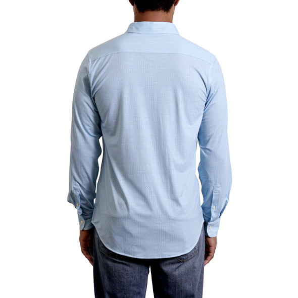 close up view of the pointed collar and neck area of knit fabric button up shirt in light blue ground with small dot geometric pattern on a black male model. The top buttons are undone